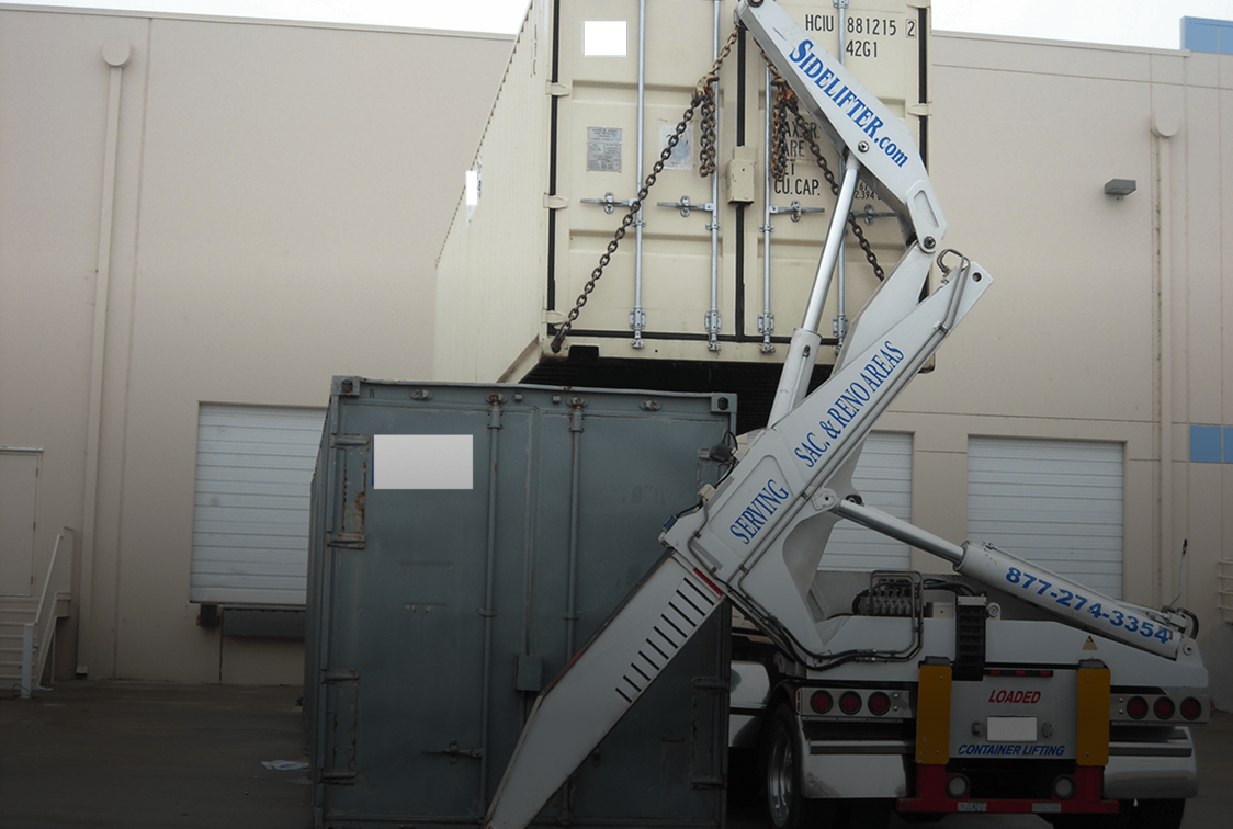 Side loader lifting shipping container